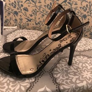 Black strap-y heels. Worn twice. Women’s size 10